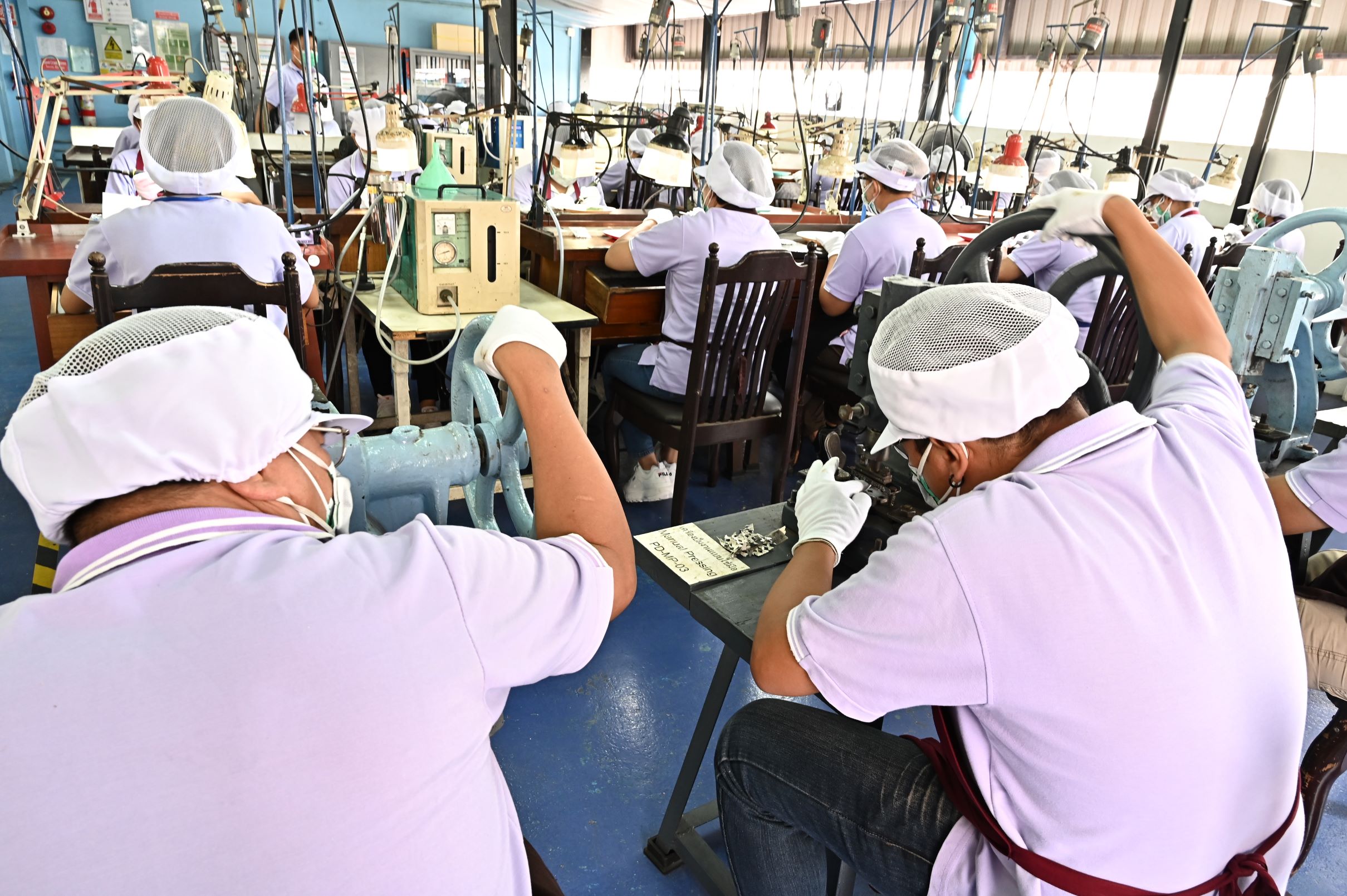 Workers inside a jewelry factory